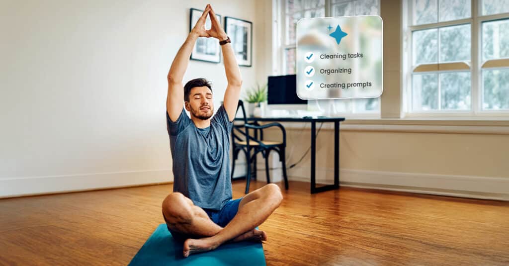 Man in a blue shirt sits cross‑legged on a blue mat, hands raised in a prayer pose in a bright room with a floating task checklist: cleaning tasks, organizing, creating prompts.