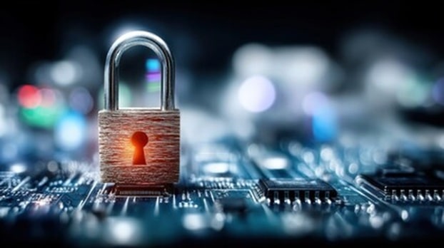 Padlock resting on a circuit board symbolizing data security and cybersecurity protection of electronics.